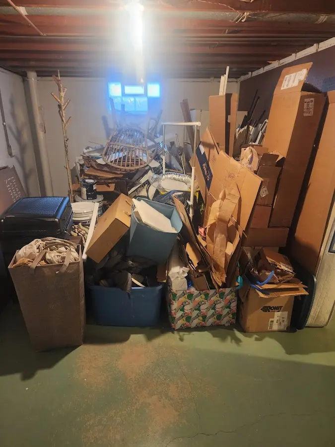 Roll-off dumpster container at job site for 2 Yard Dumpster Rental in Londonderry